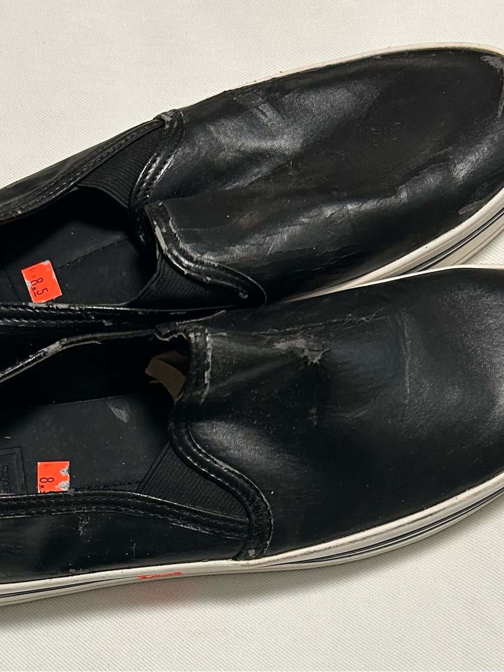 DV by Dolce Vita Black Slip-On Leather Sneakers with White Sole